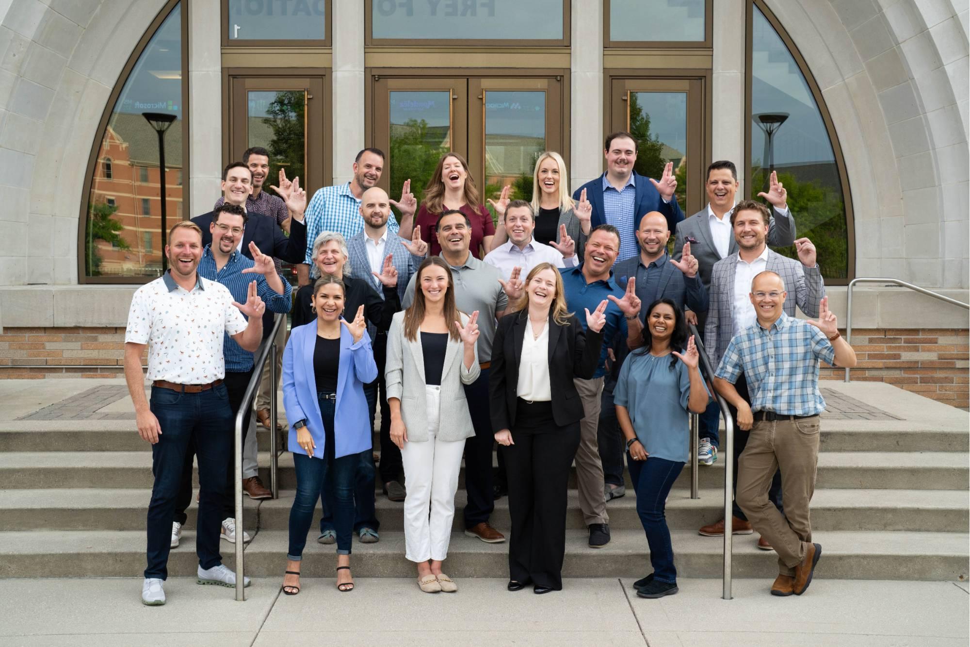 Alumni Network Leaders anchor up outside the Seidman College of Business